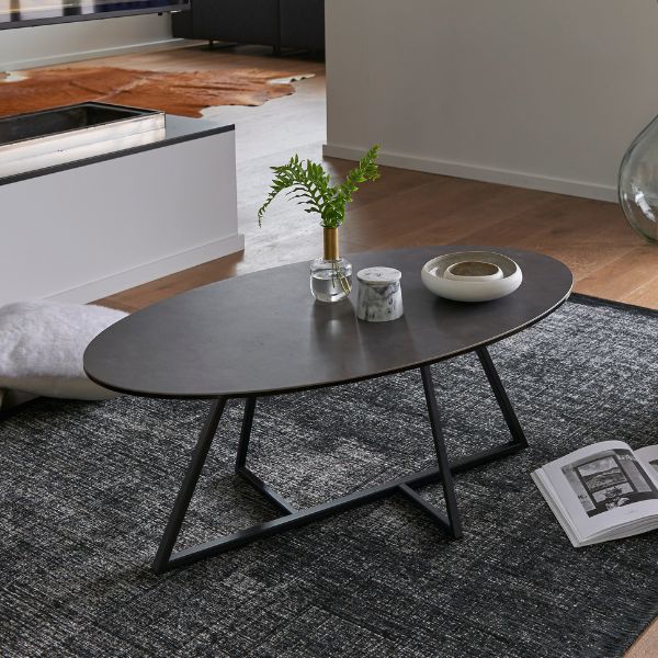 Table basse ovale et pied en croix décentré